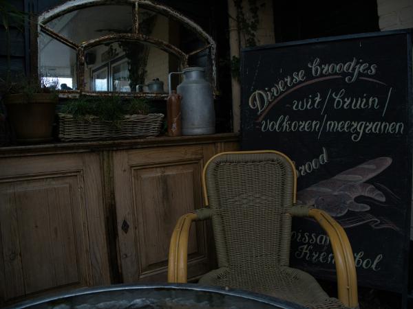 Chair in front of a chalkboard menu