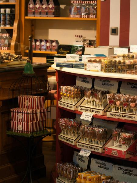 Chocolate lollipops displayed on shelves in a store
