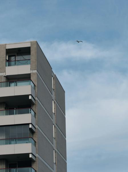 Modern apartment building against a cloudy sky