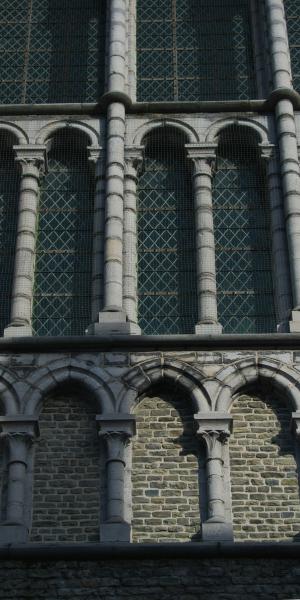Stone arches and columns on a brick building facade